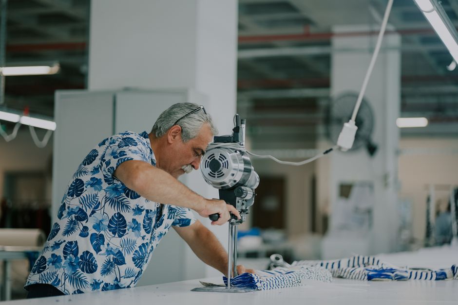 Precision fabric cutting machine on a factory floor